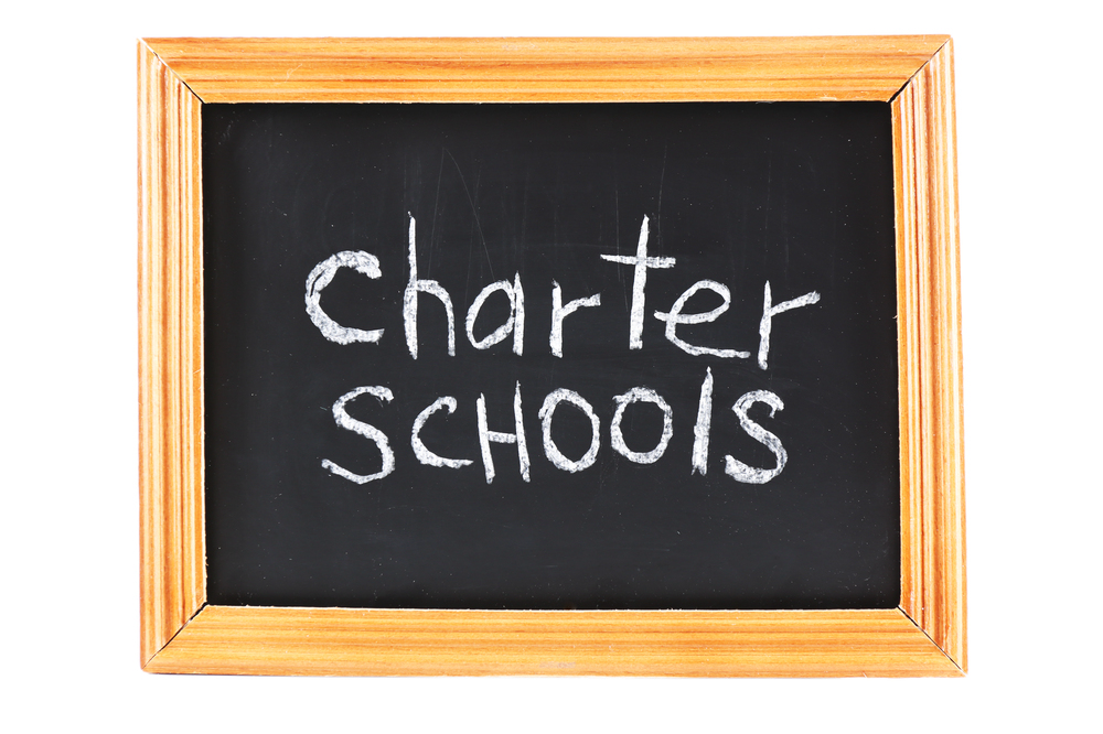 graphic of small chalkboard with charter schools written on it