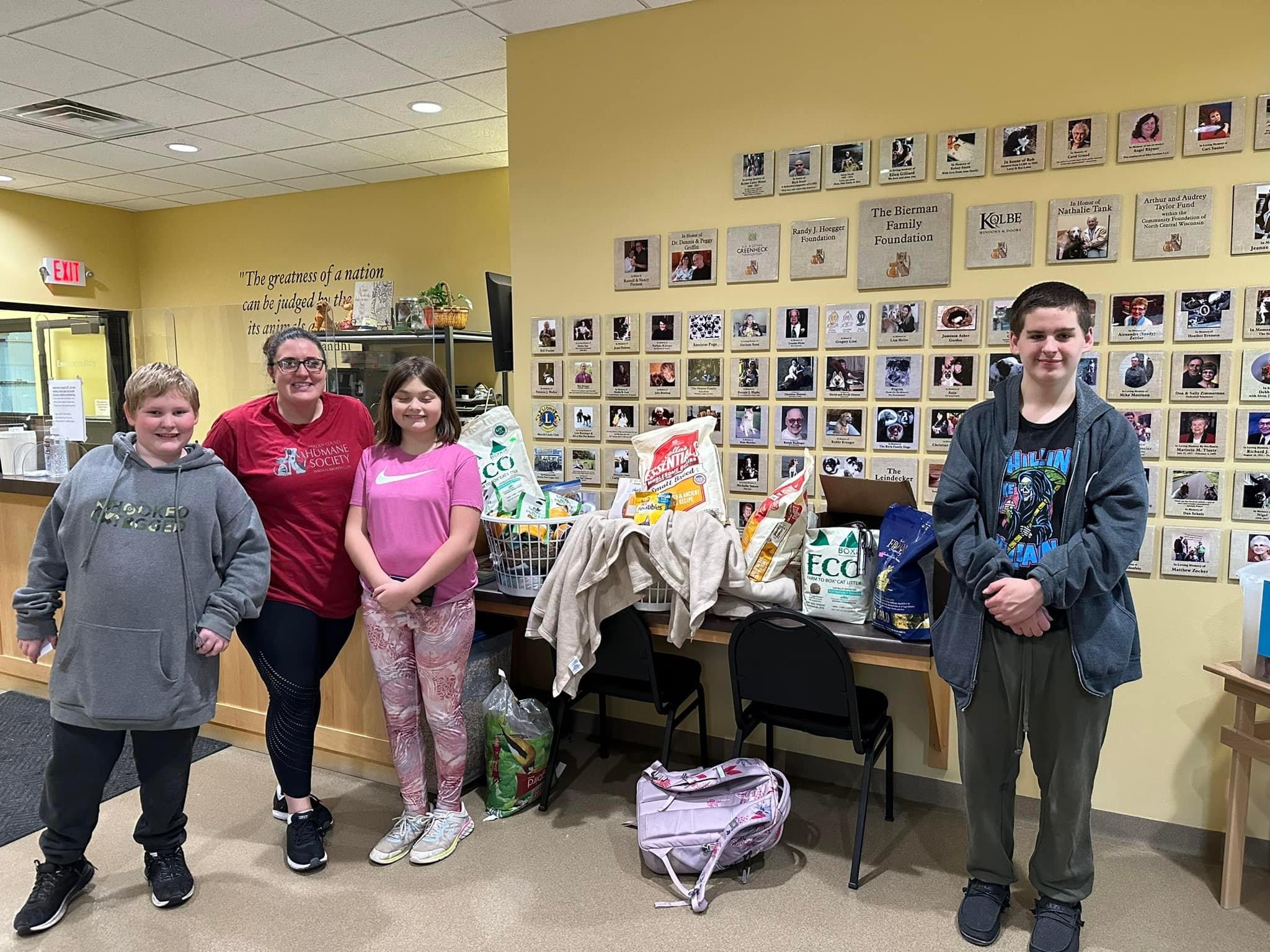 middle school students with animal shelter donations