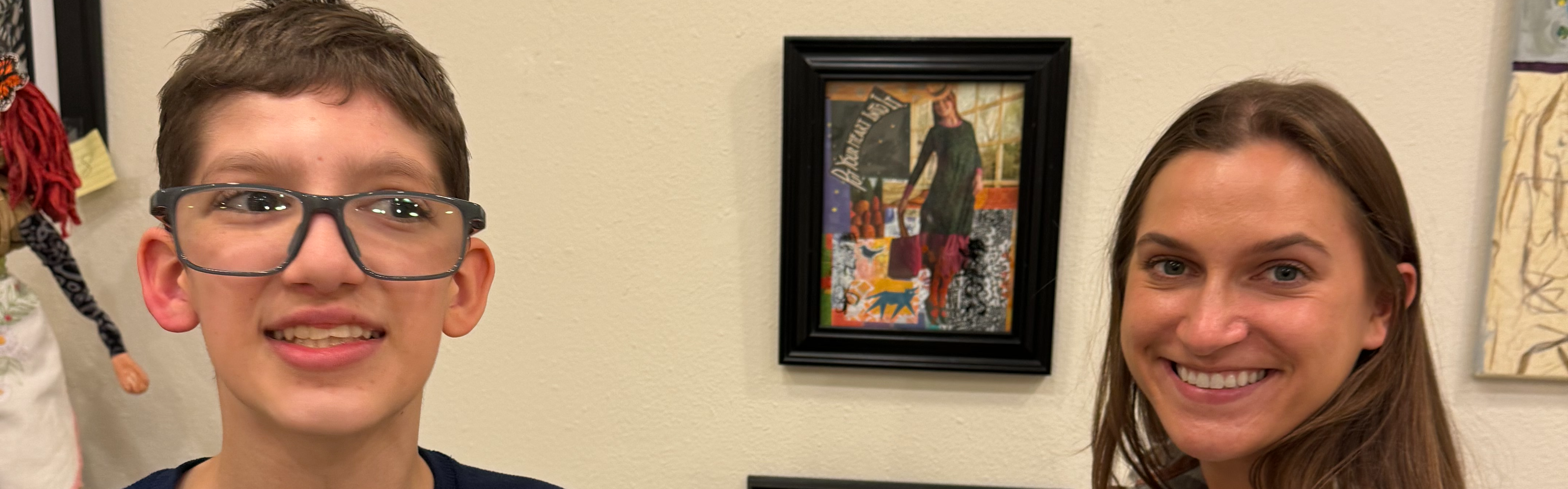 student and OT at art show
