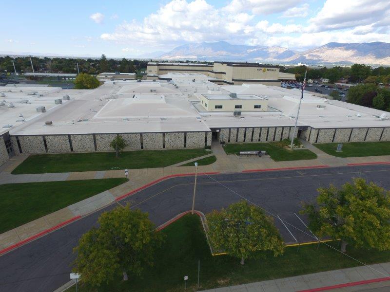 large beige building and parking lot