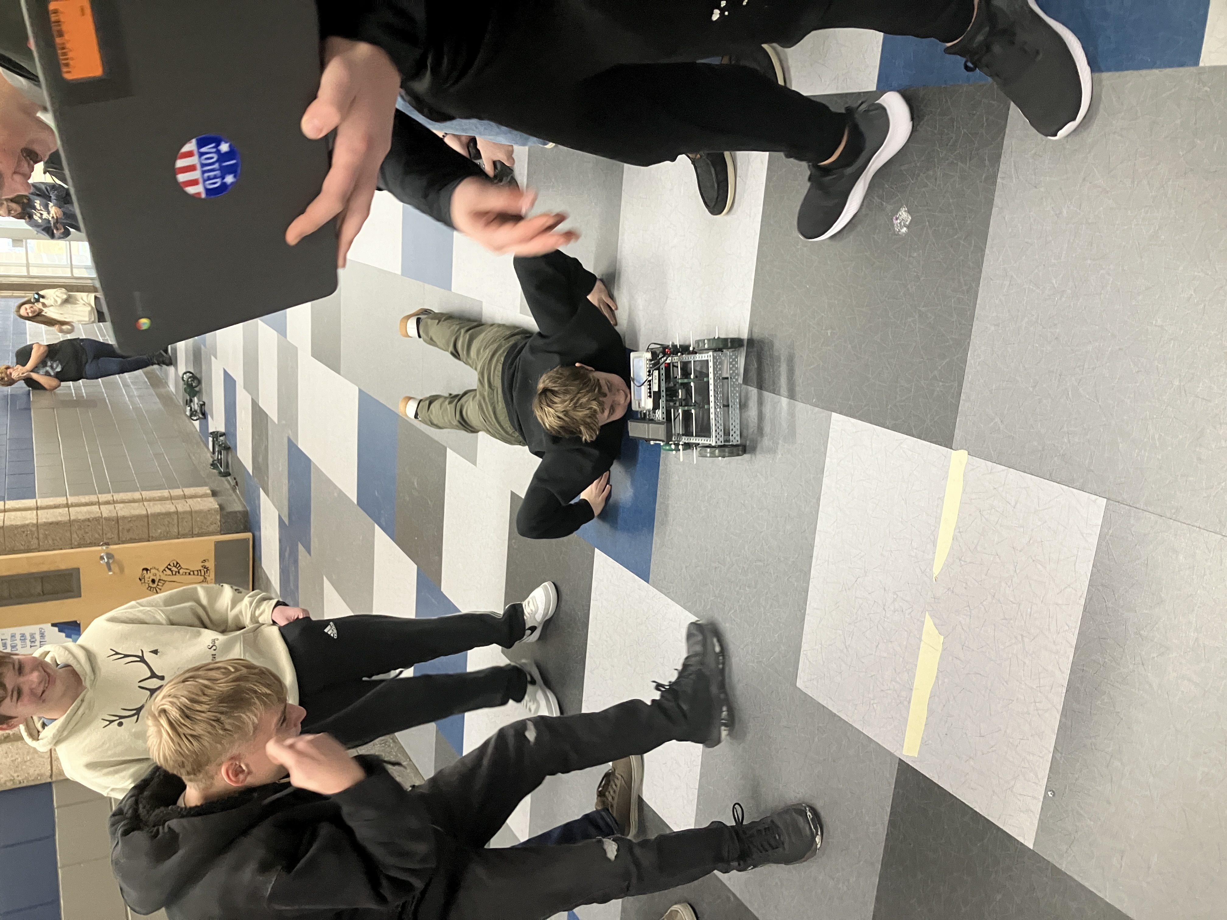 After two weeks of designing and building the Robotic Engineers are testing their designs and seeing who has the fastest car with some class Drag Racing down the halls