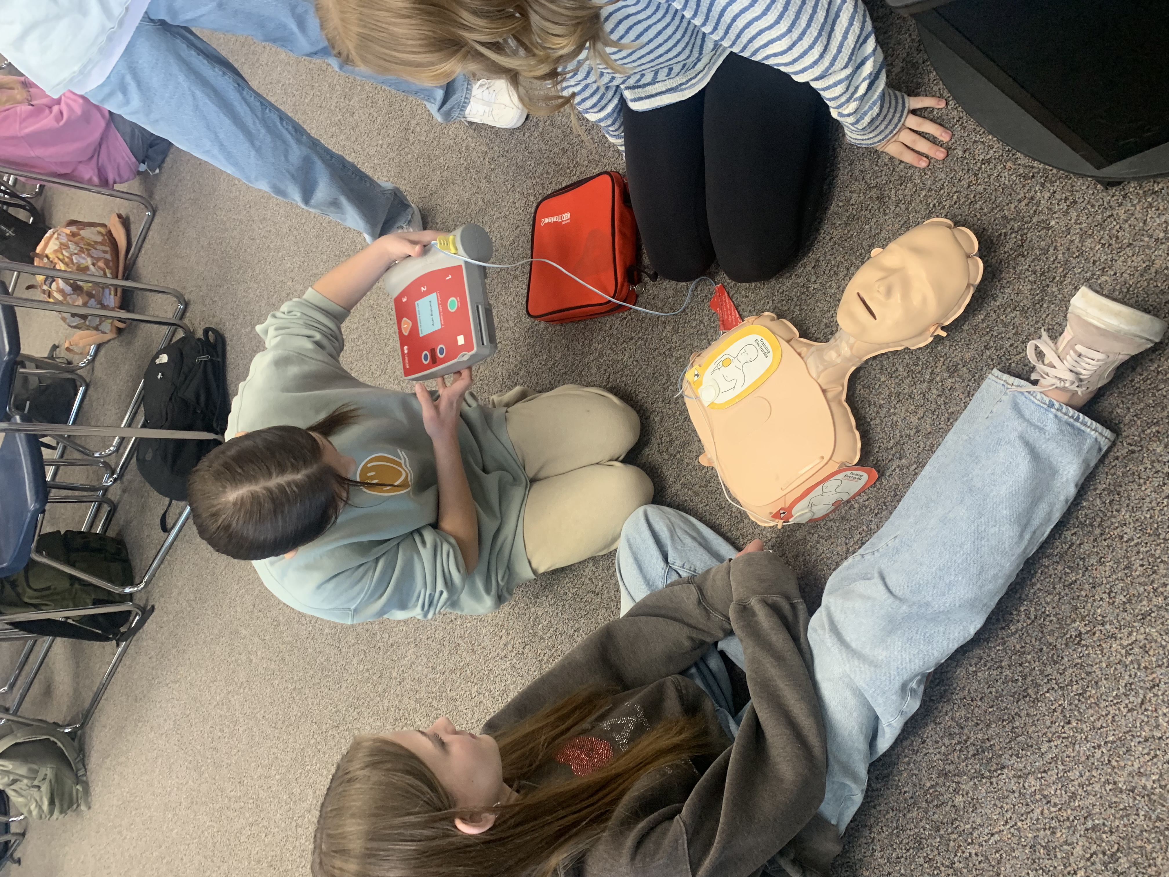 students learning CPR