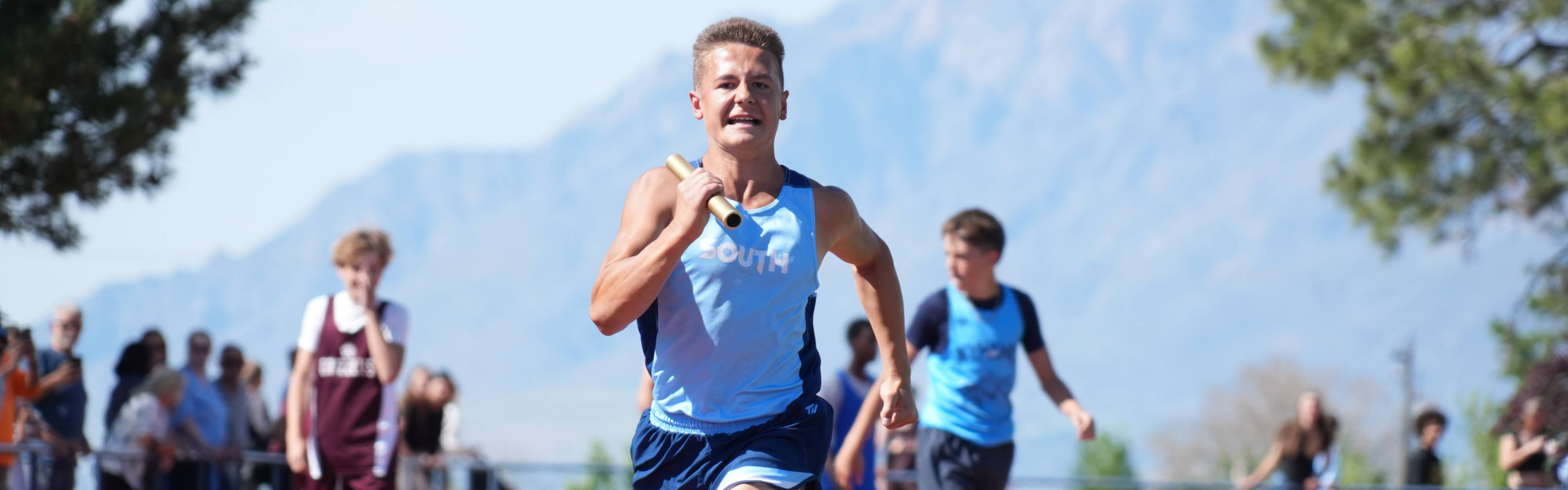 student running at track meet