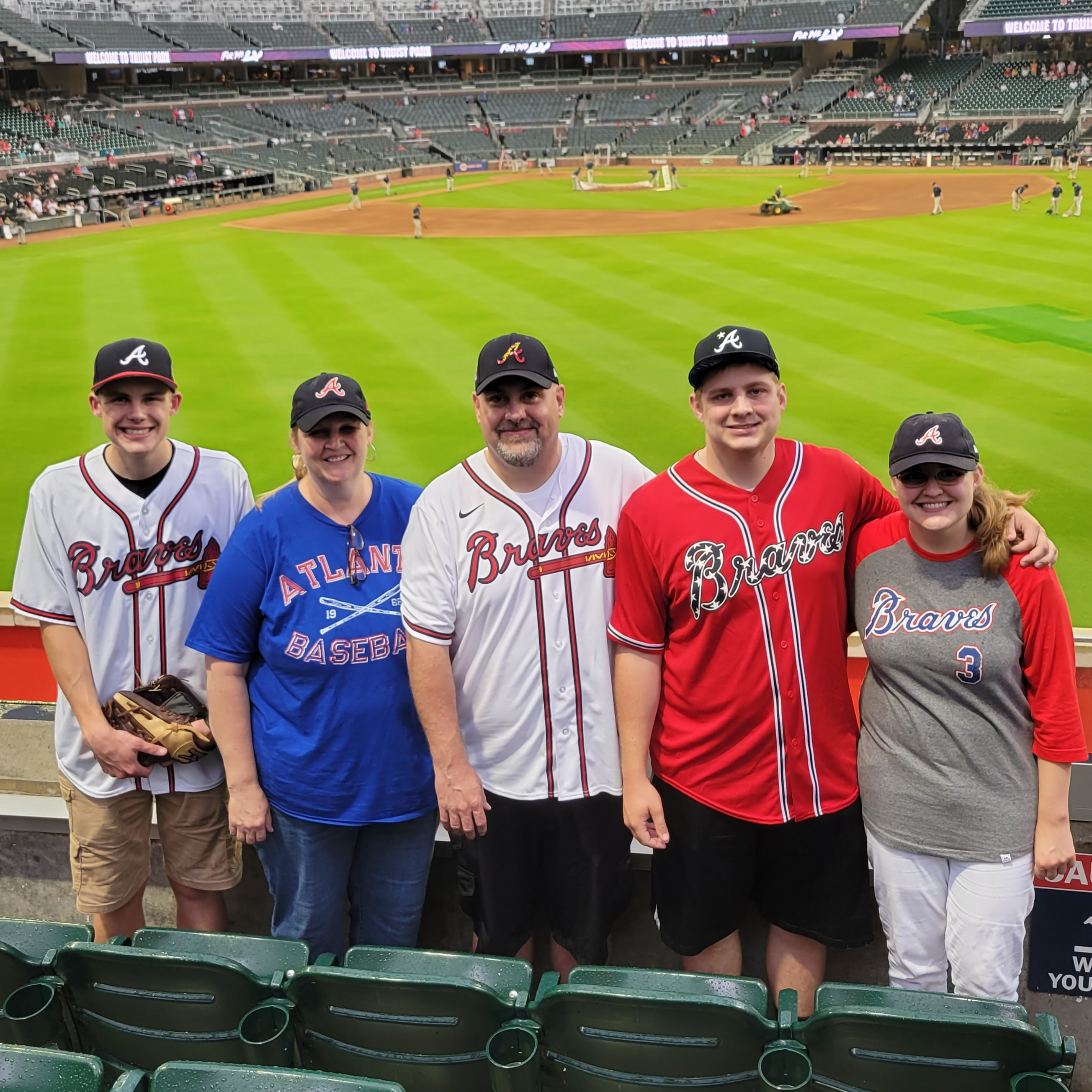 Mrs. Talbot enjoys baseball games with her family.