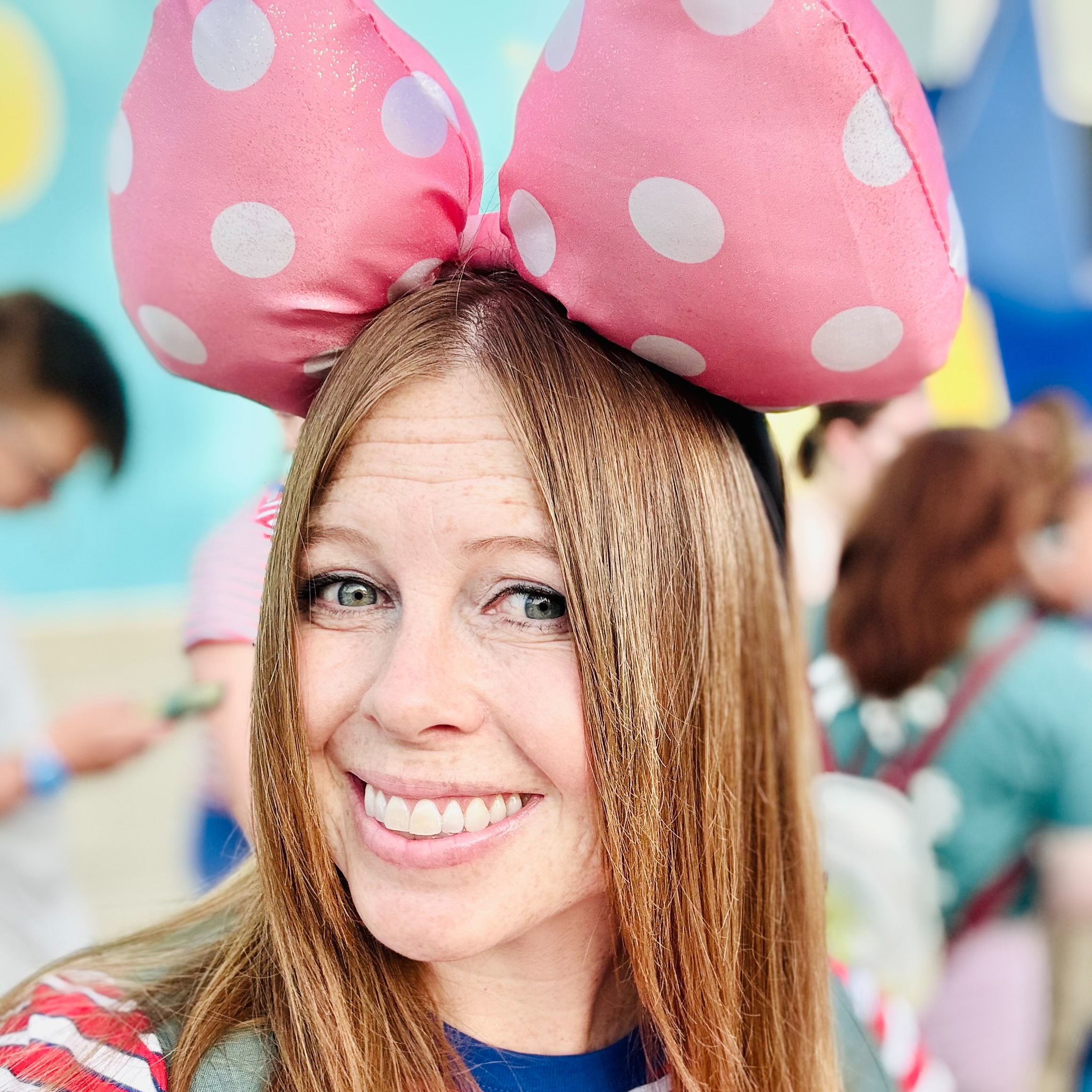 Photo of Mrs. Stephens with big pink Minnie ears 