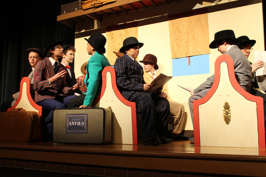 Music Man men on the train for opening song