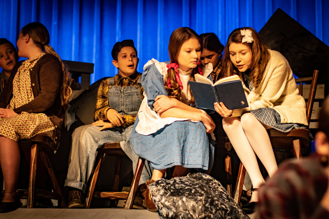 The Girl in the White Pinafore classroom scene