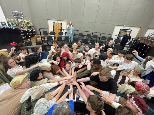 Be Brilliant group hands in