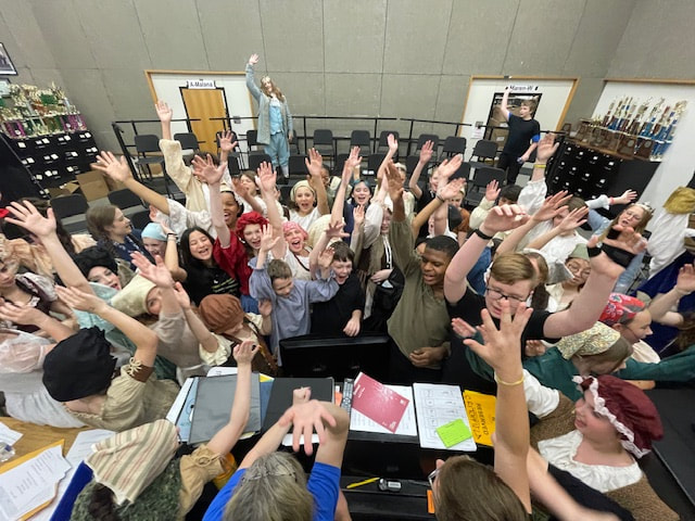 Be Brilliant group hands up