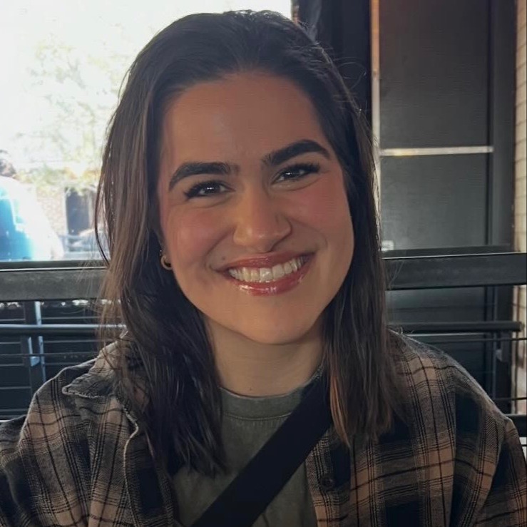 A headshot of Laurel Kroesch, assistant director smiling against a neutral background