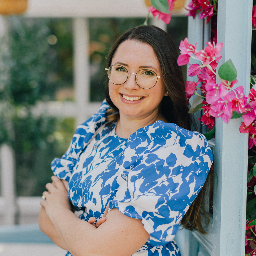 Teacher smiling in a blue dress