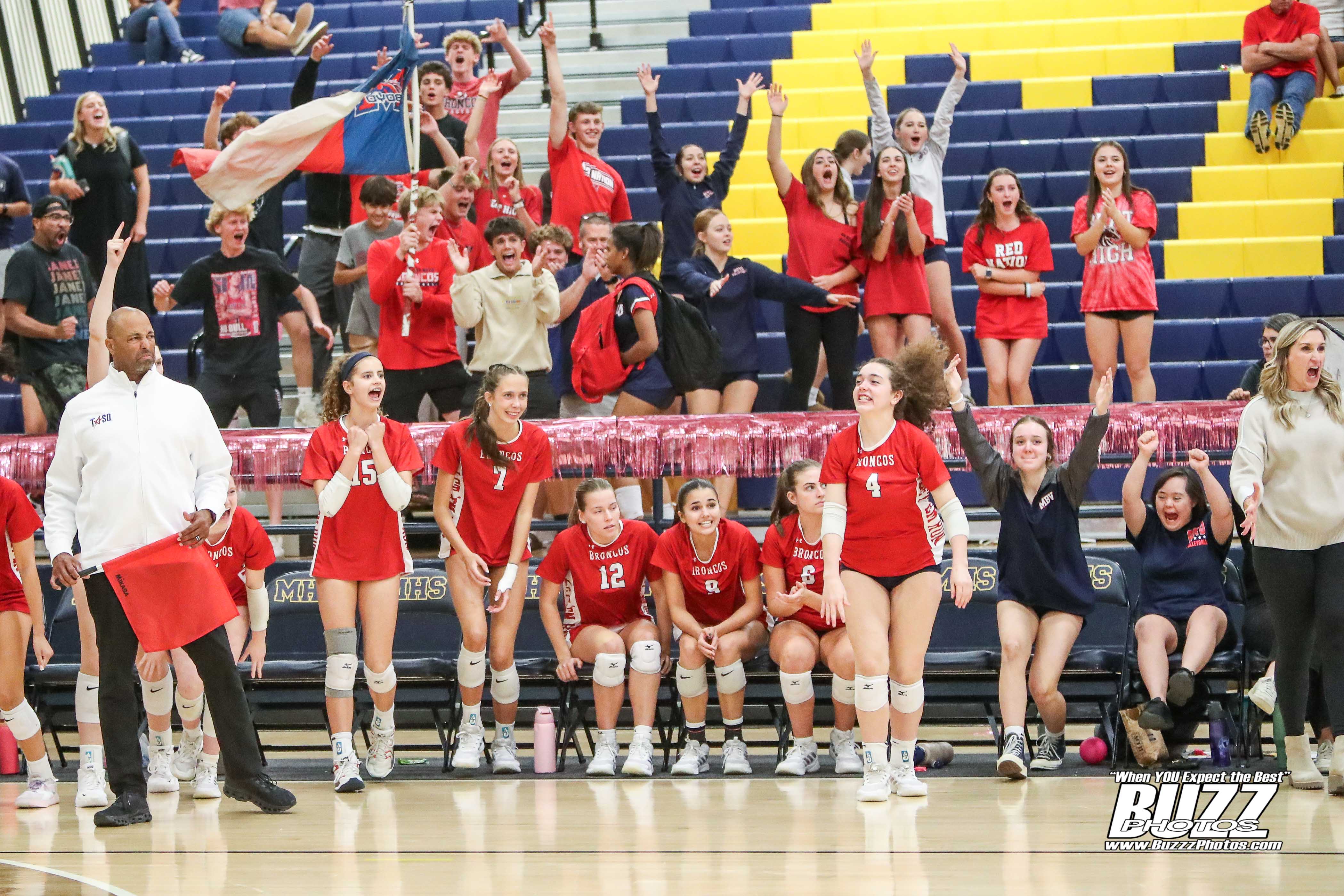 McKinney Boyd volleyball sideline getting excited and cheering for the win