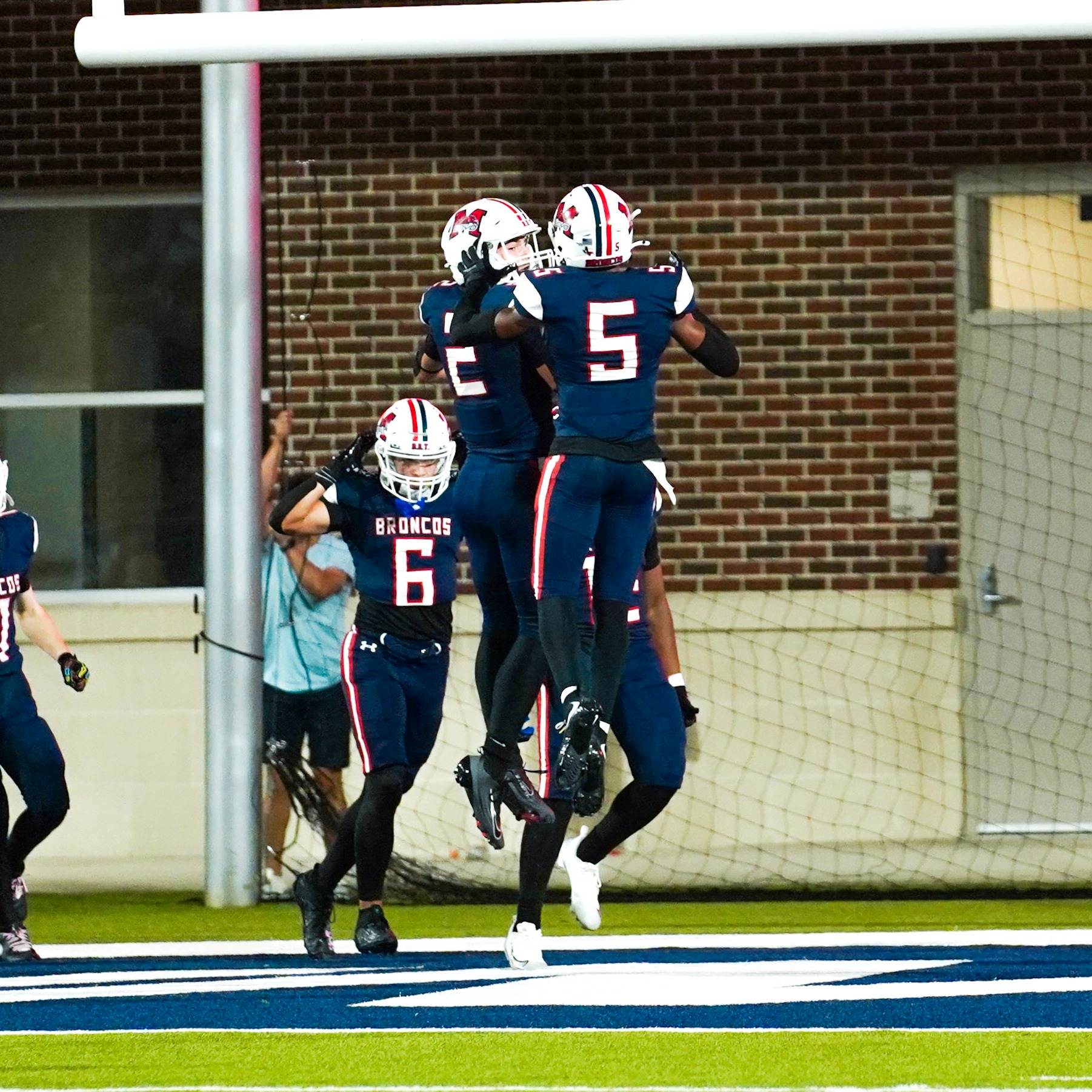 Football players celebrating after a touchdown