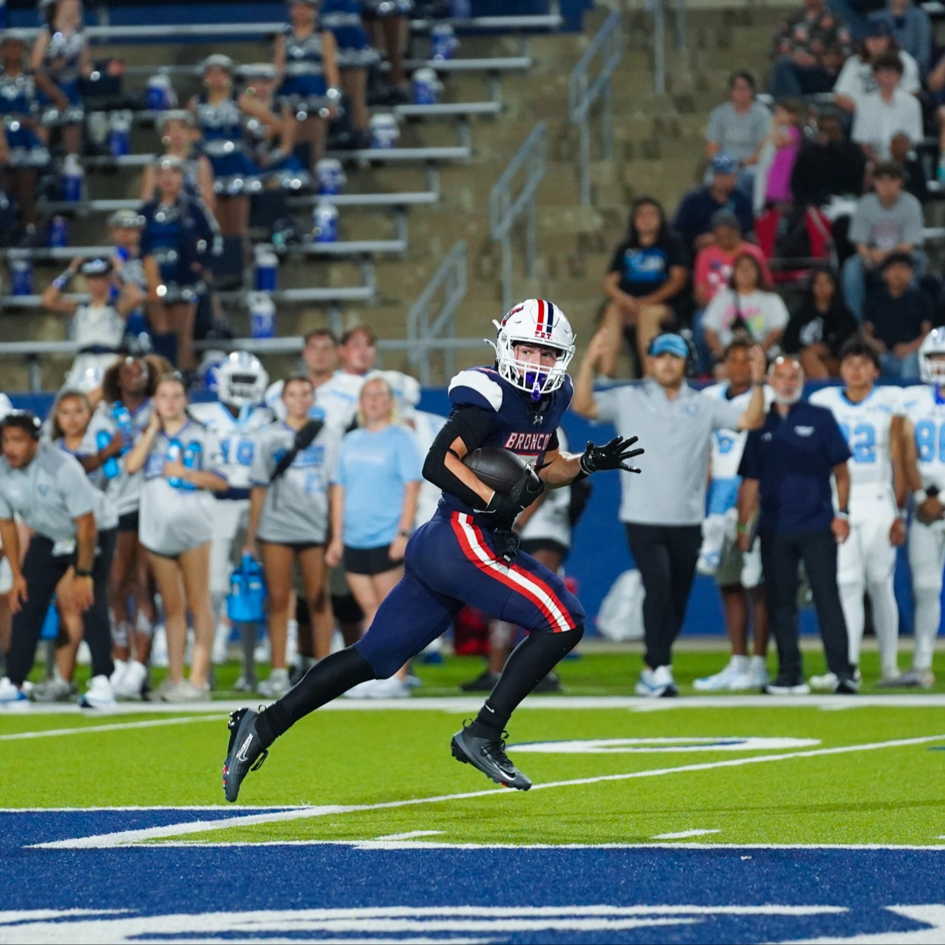 Football player running with the ball