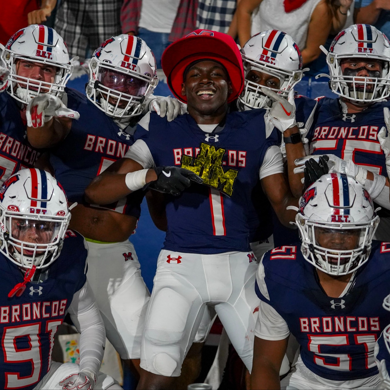 Football players celebrating on the sideline