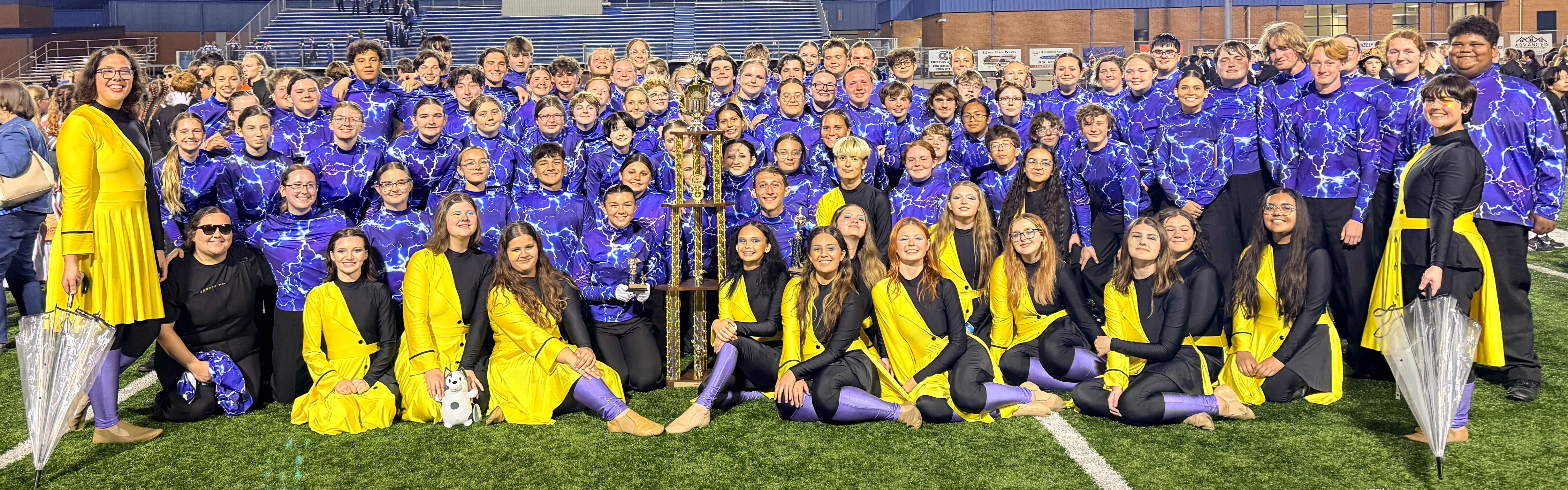 band on field with trophy