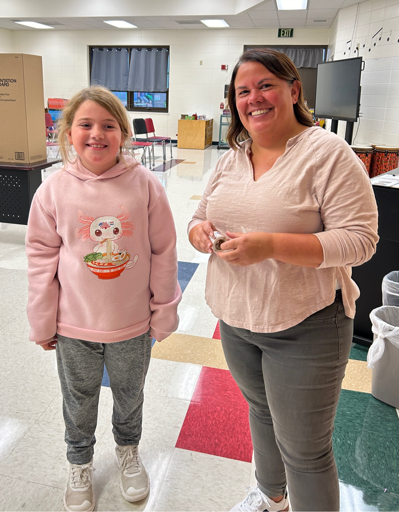 Ms. Brauer with Student in classroom for Playground election day