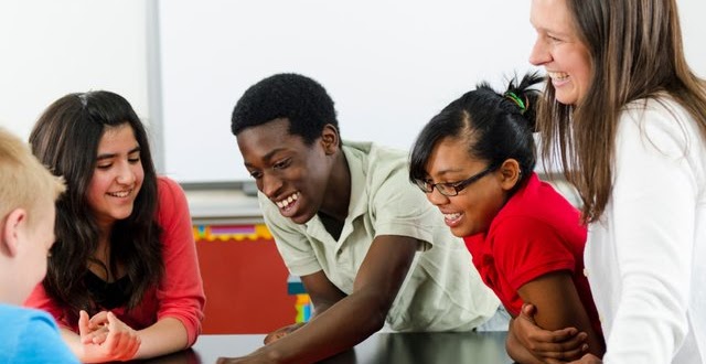 Happy students with a teacher