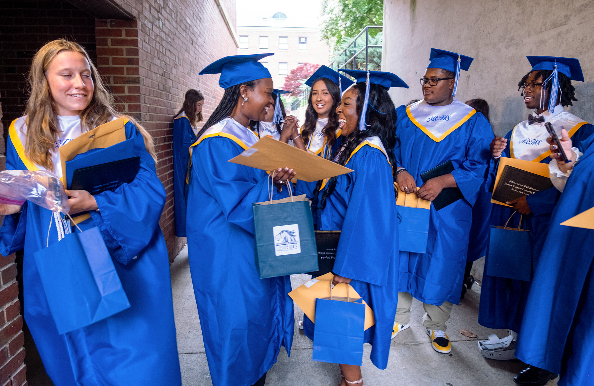 Middle College High School graduates celebrating after commencement