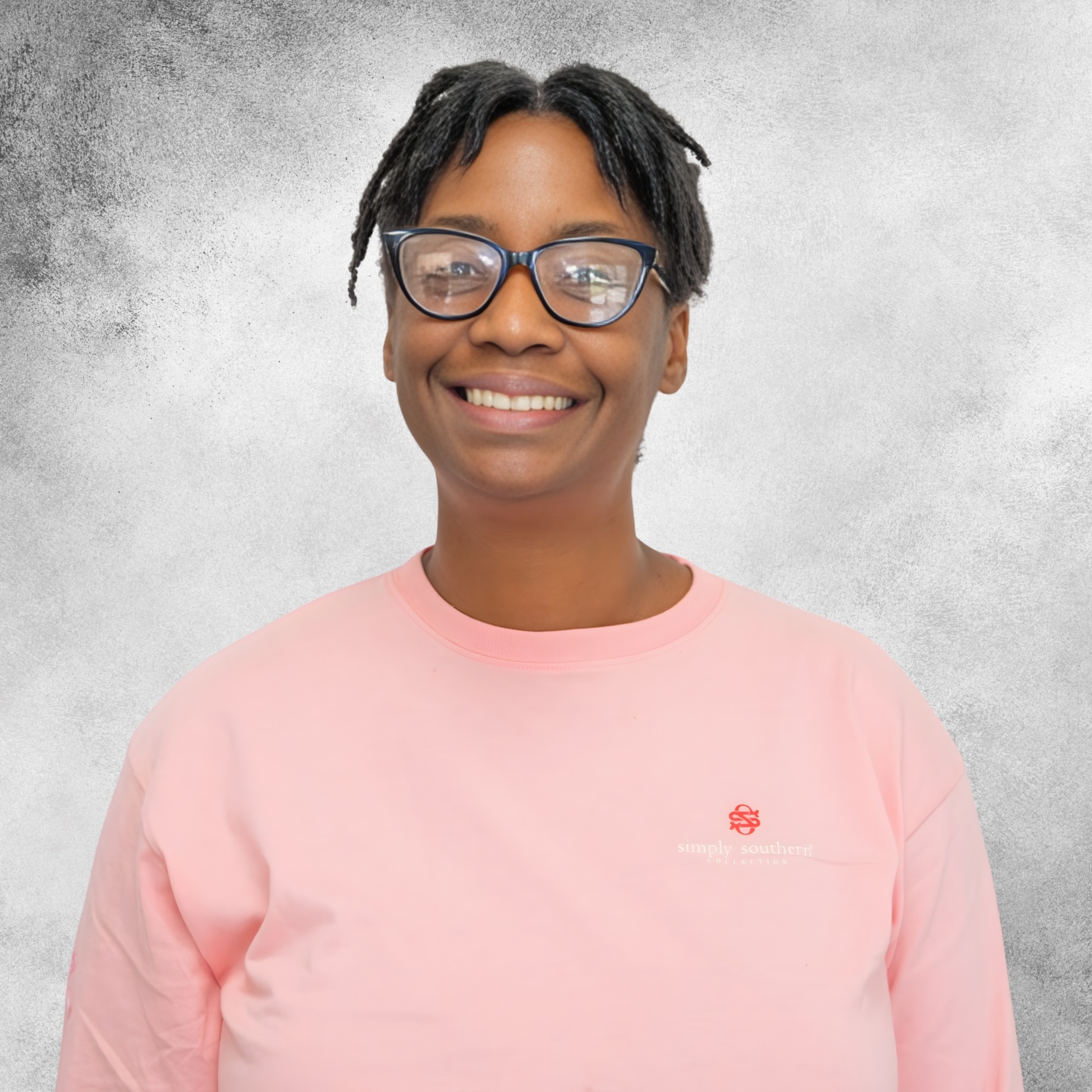 Jennifer Simmons in a pink tee