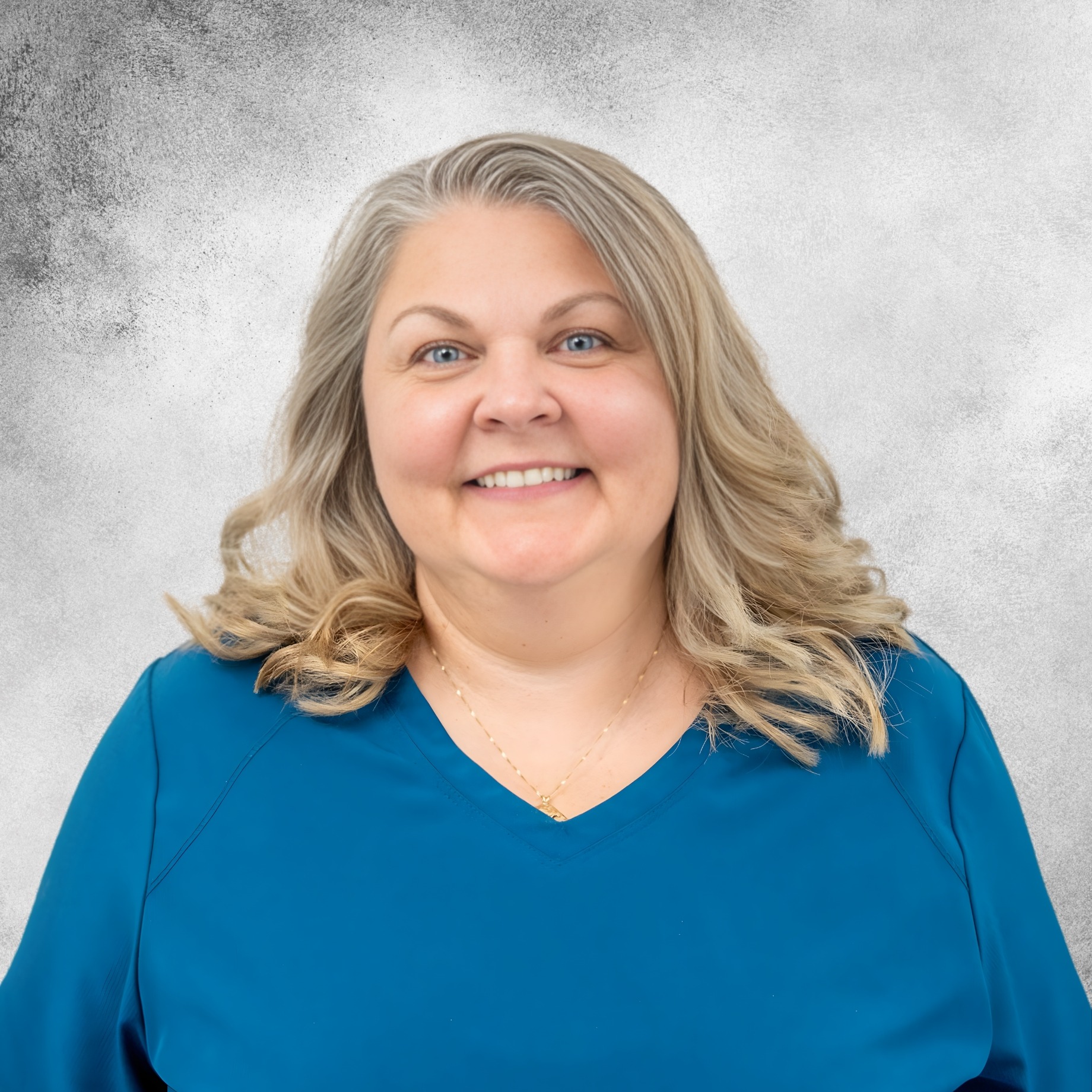 Virginia Martin in blue scrubs