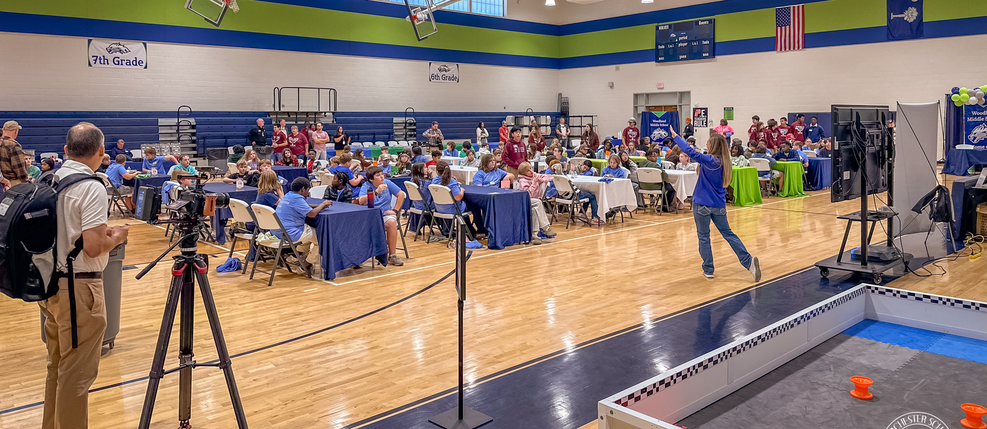 Woodland Middle School gymnasium filled with students working at tables at the Kids Robotics workshp