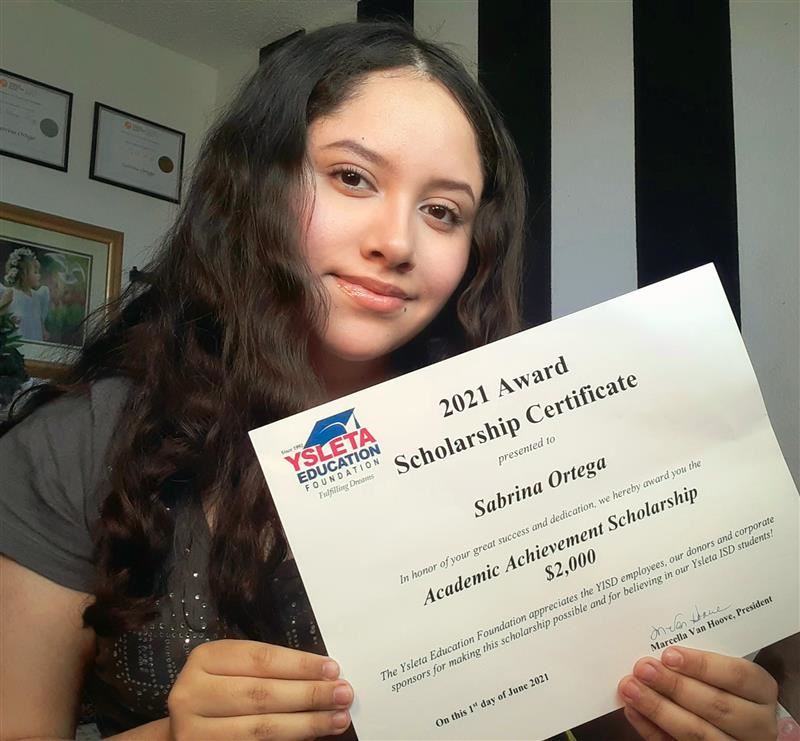 2021 recipient holding a diploma