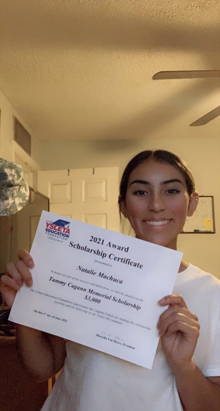 2021 recipient holding a diploma