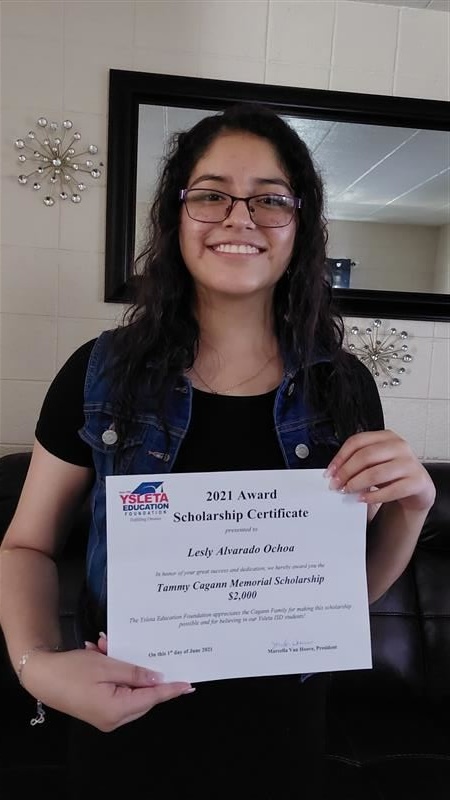 2021 recipient holding a diploma