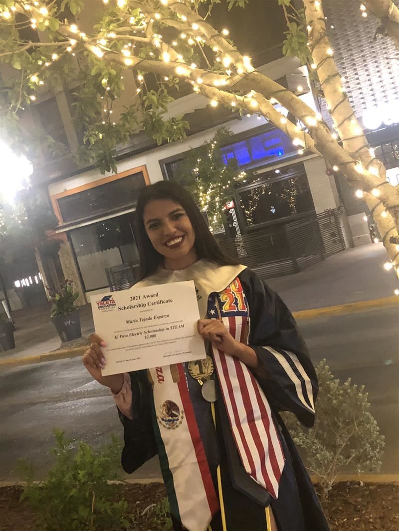 2021 recipient holding a diploma