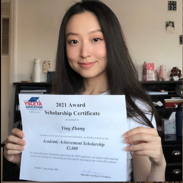 2021 recipient holding a diploma