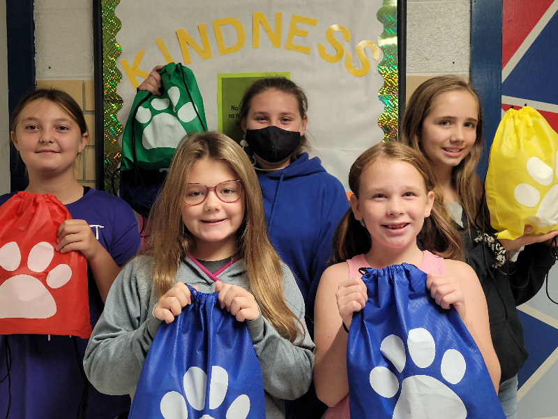 group of elementary students smiling at the camera