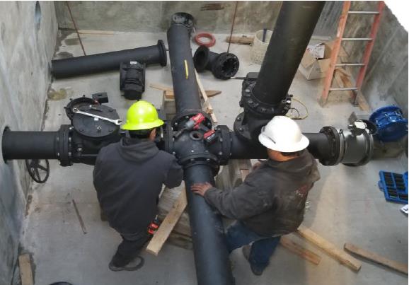 Working to install Lift Station piping, valves and magmeter.
