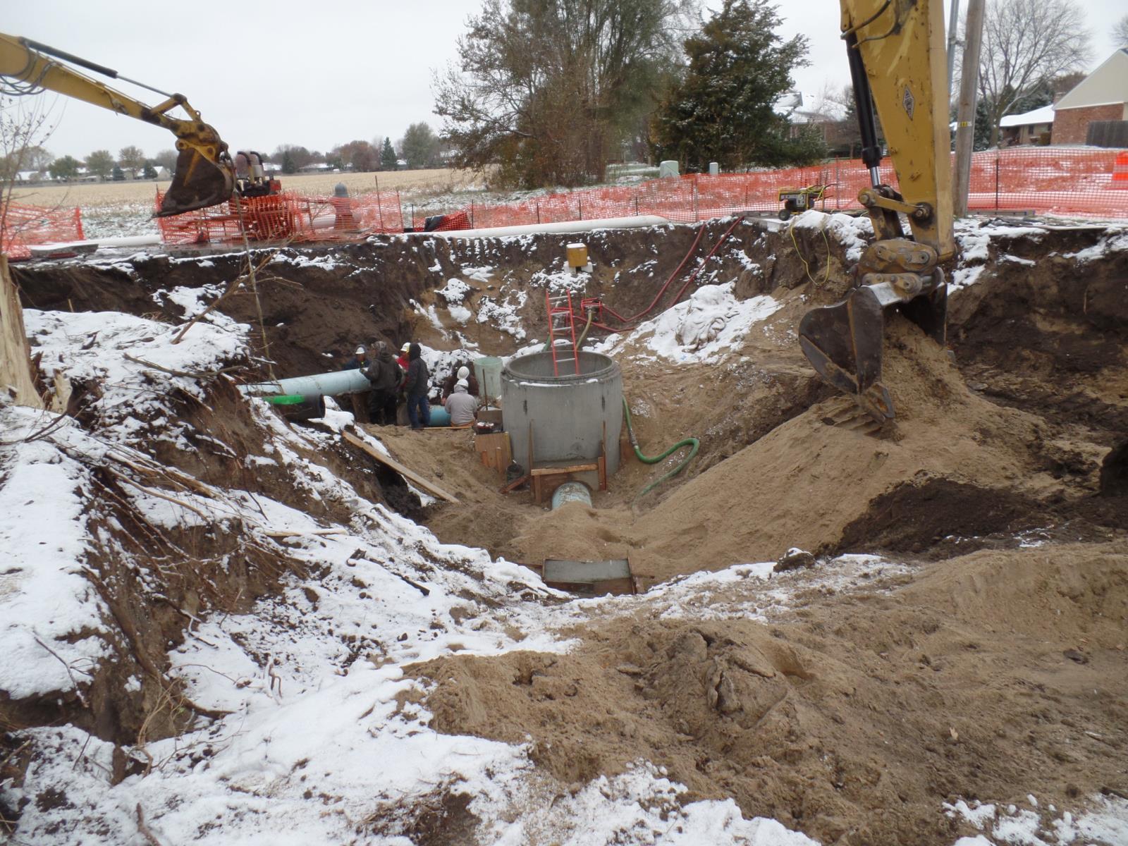 Workers repairing drainage system