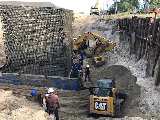 Workers repairing drainage system