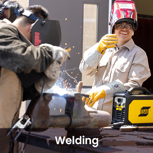Welding students working