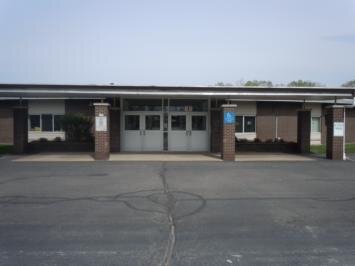 An empty parking lot in front of a building