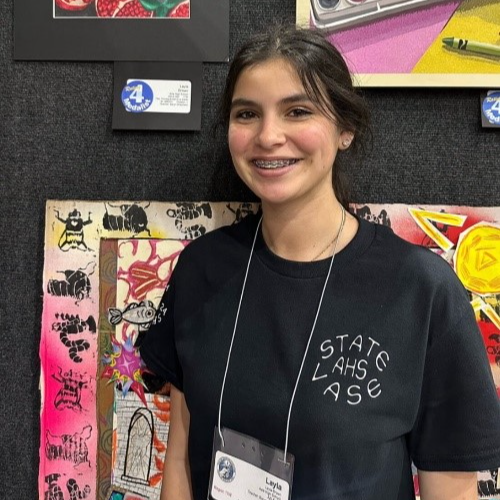 girl standing next to artwork in VASE contest