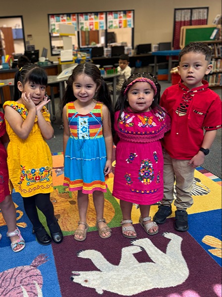 Four students dressed in celebration of Hispanic Heritage Month.