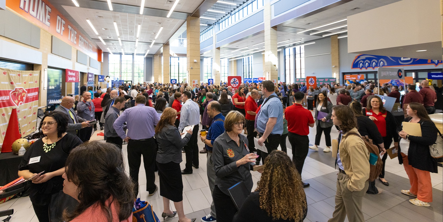 A crowd of people at a job fair.