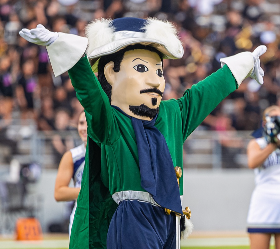 College Park Cavalier mascot pointing to the crowd at a football game.
