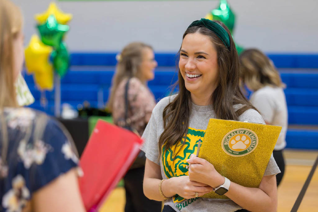 Campus representative speaking to a candidate.