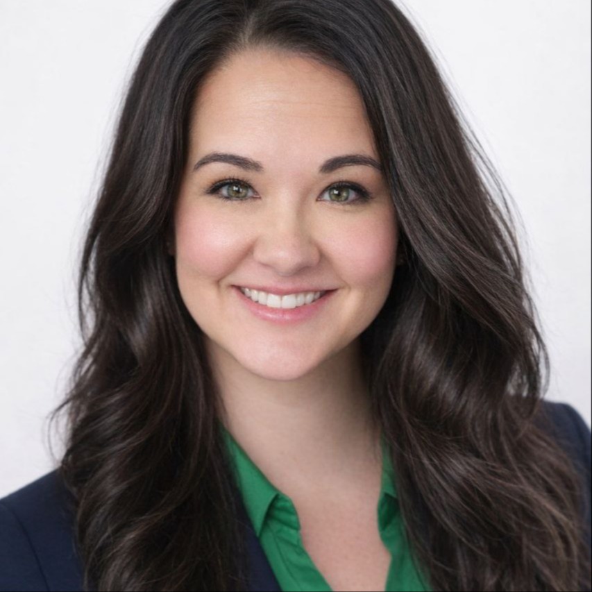 Head shot picture of Shannon Pirih, Elementary Math specialist. She is wearing a green collared button up shirt. She has long brown hair and brown eyes