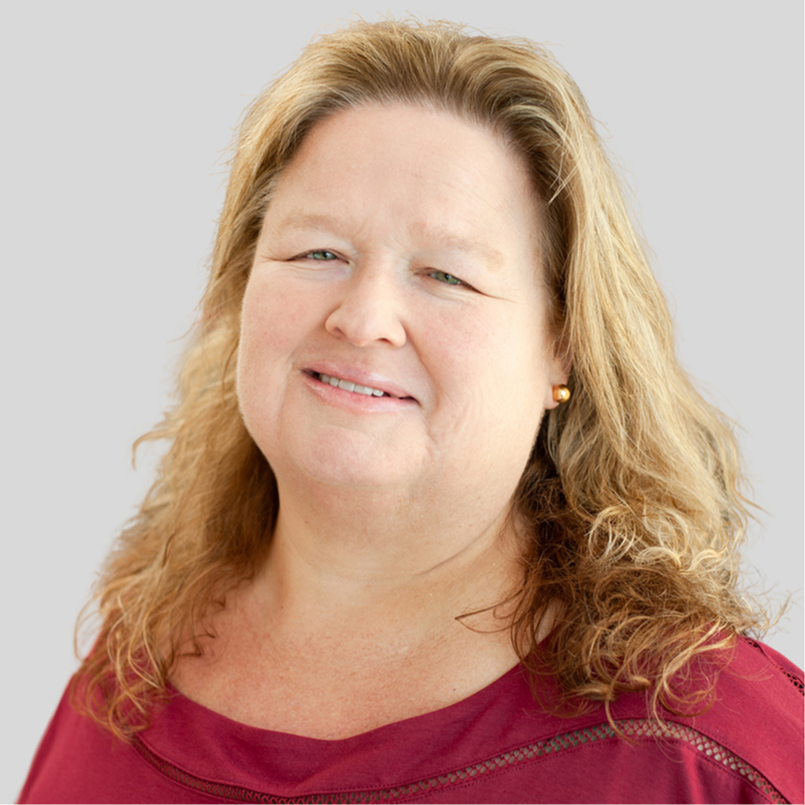 Headshot of Susan Coscio, Early Childhood District Instructional Coach. She is wearing a red blouse . She has blonde hair and blue eyes.