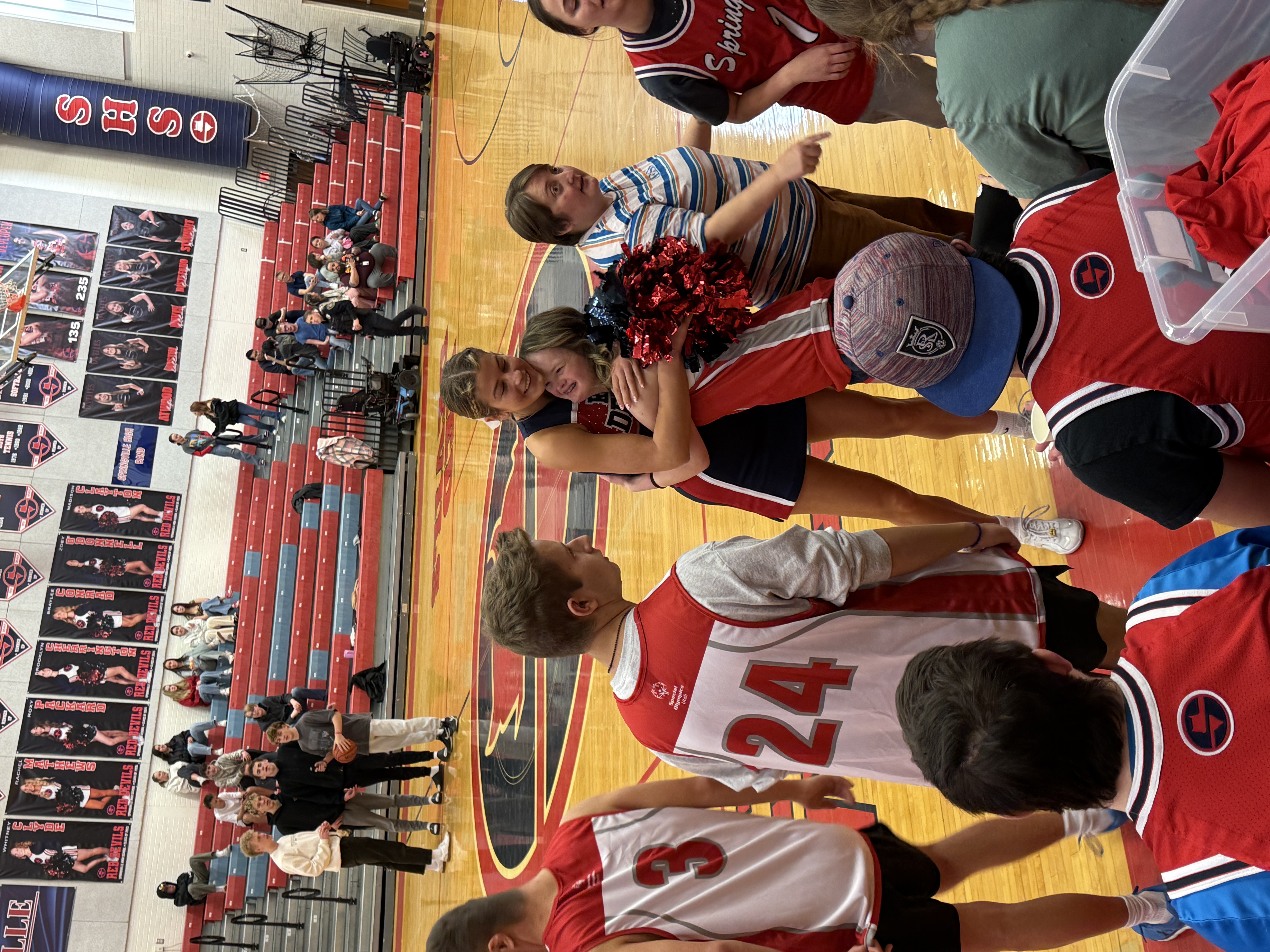 Unified Basketball students hugging