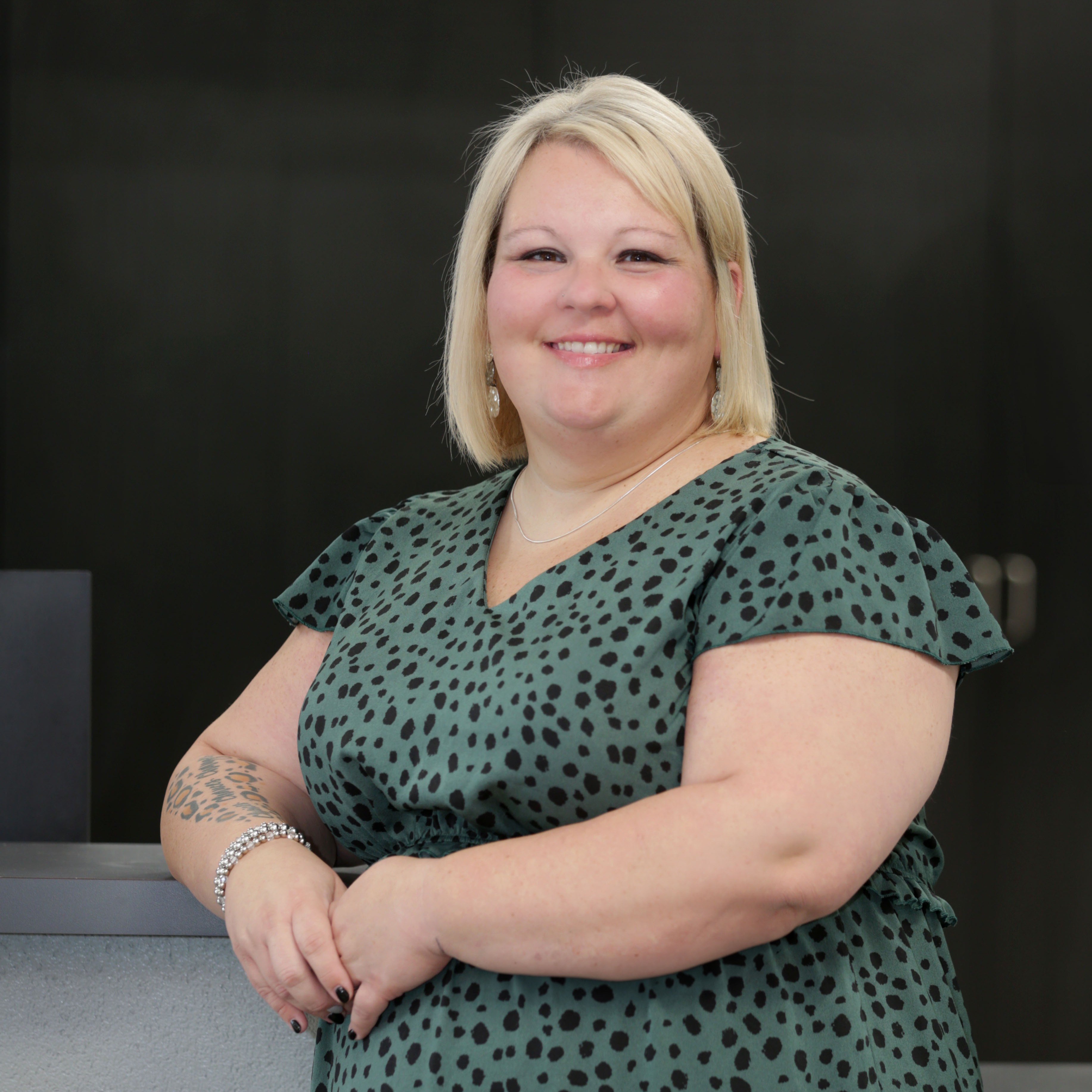 woman standing next to counter