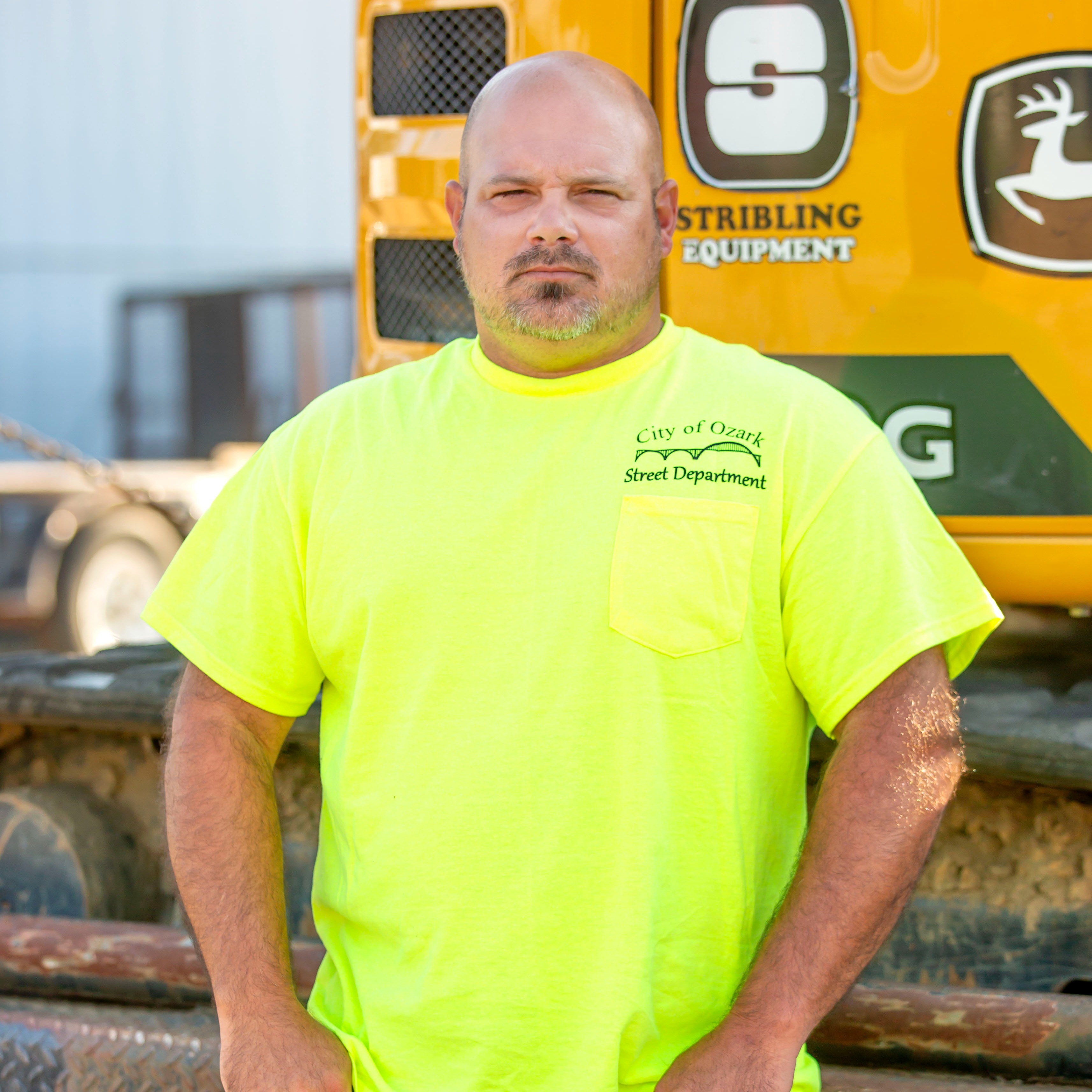 Man standing next to machinery 