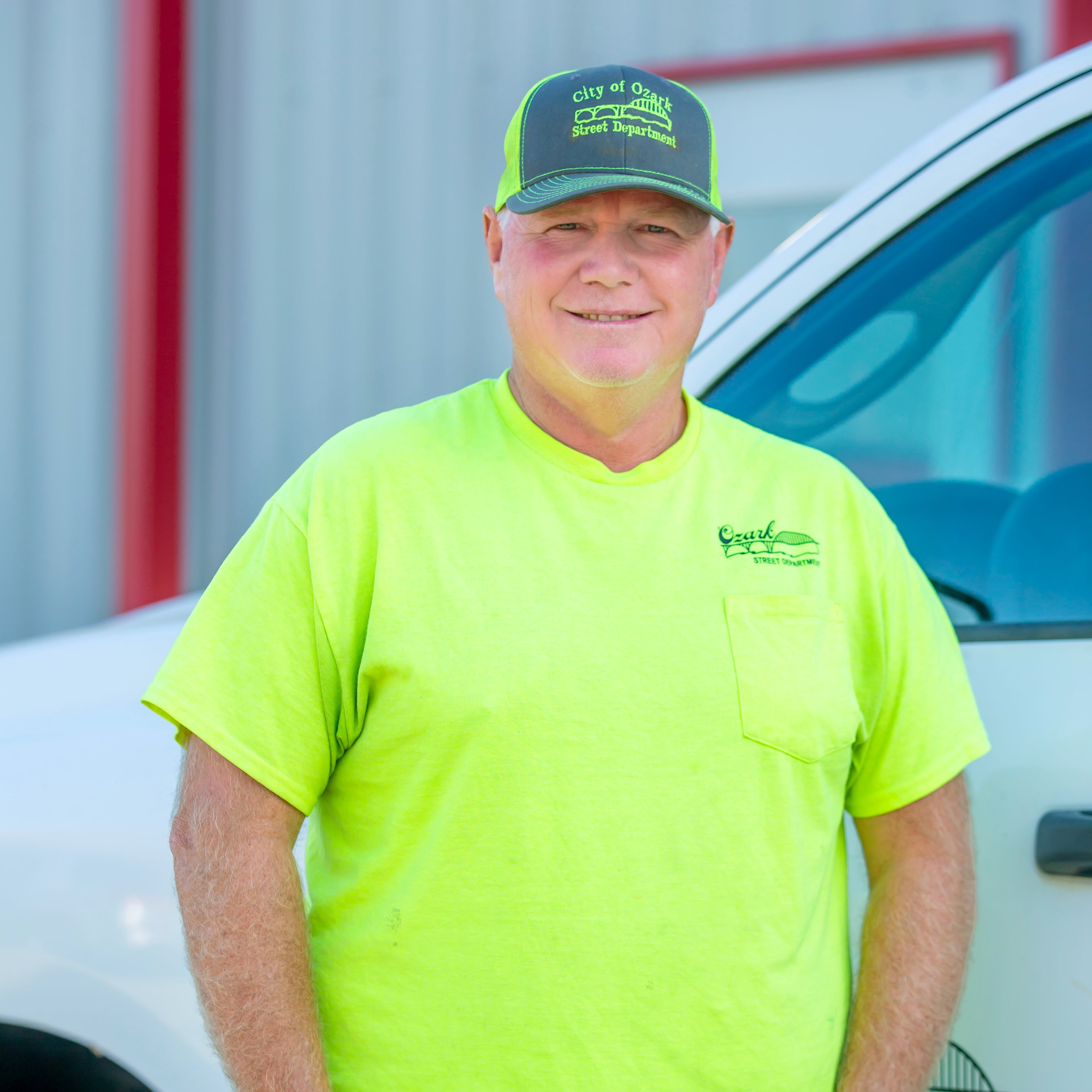 man standing next to truck