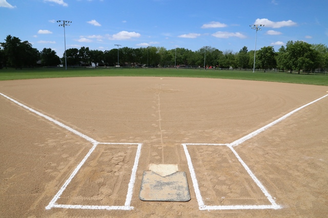 A baseball field with a base in the middle of it
