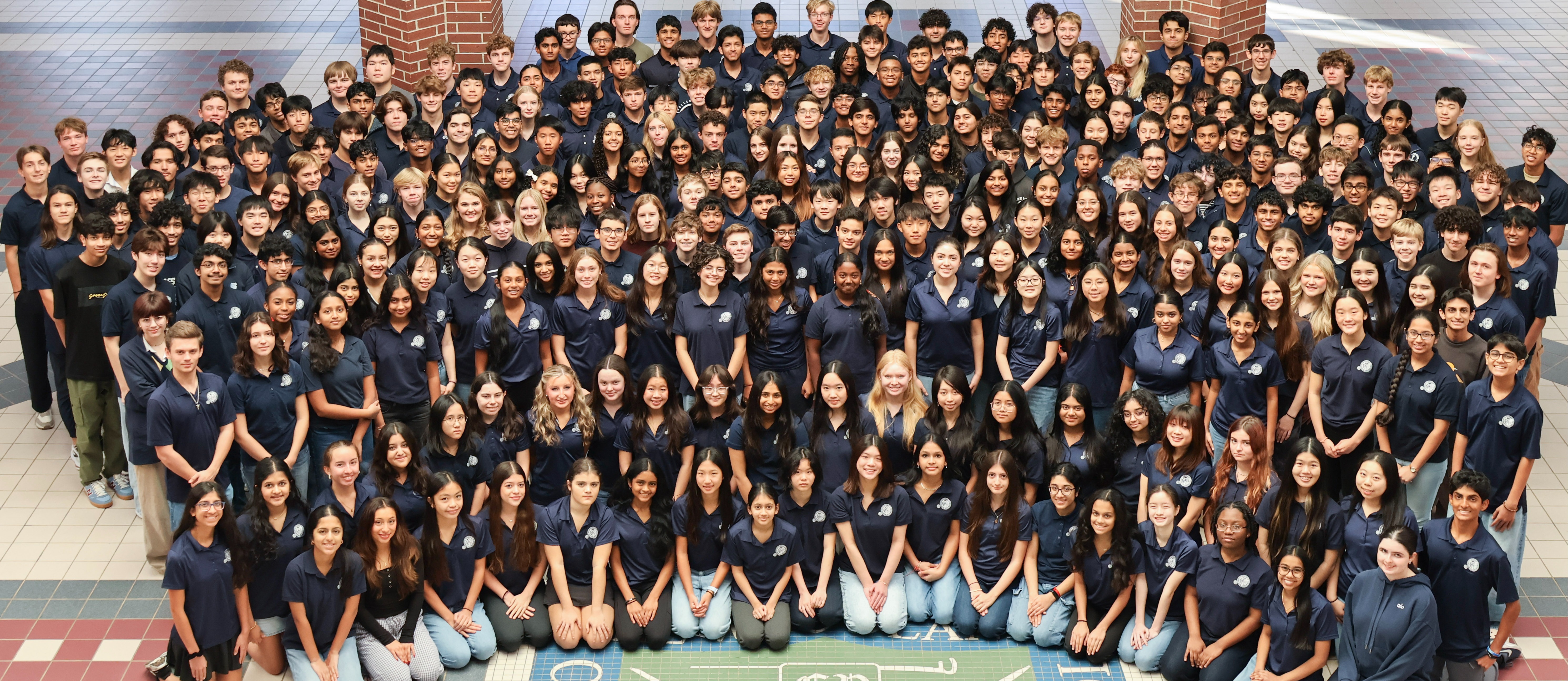 Students in the Academy of Science and Technology under the school rotunda.